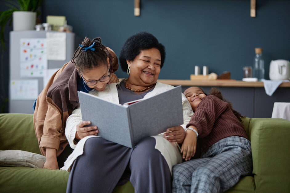 Mature Grandmother reading to grandchildren